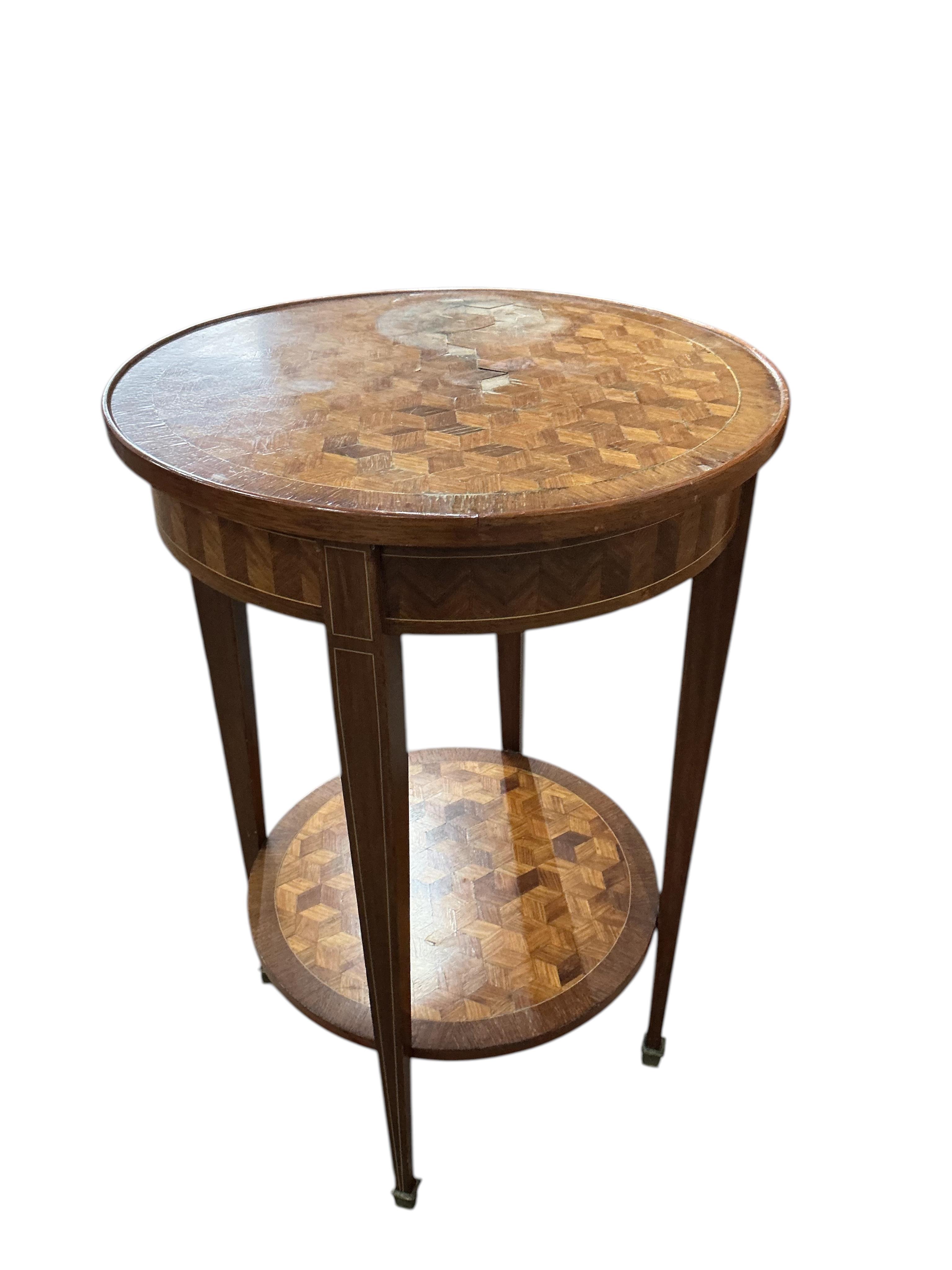 A French transitional style circular parquetry inlaid two tier table, diameter 50cm, height 75cm